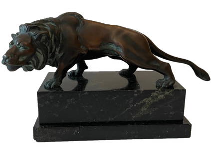 Bronze lion sculpture on a marble stand: Description: Bronze lion sculpture on a marble stand. Measurement approximate: 6 x 7.5” on a stand / Stand 2.75” HMaterial: Bronze