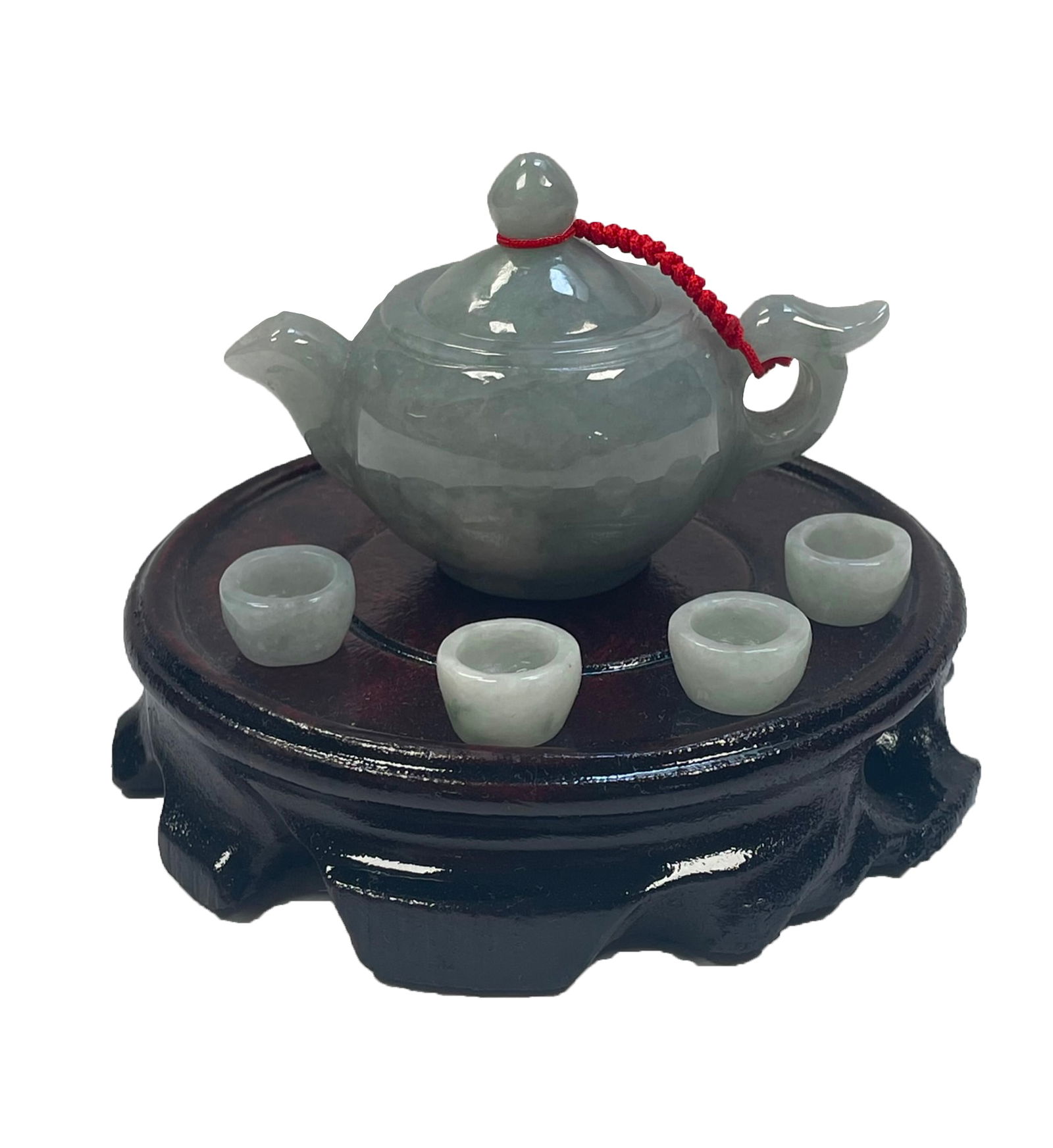 Jade teapot and 4 cup with certification/ on a stand/Box: Description: Jade teapot and 4 cup with certification/ on a stand/BoxMeasurement approximate: 2.2"h (tea pot), 3.2"(with stand), .5" (tea cups)Material: Jade