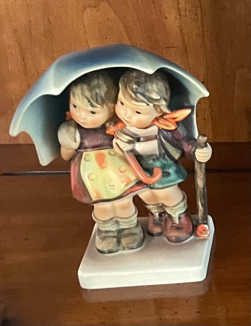 Hummel "Stormy Weather" Figurine: Description: Hummel "Stormy Weather" Figurine; Measurement Approximate: ; Material:
