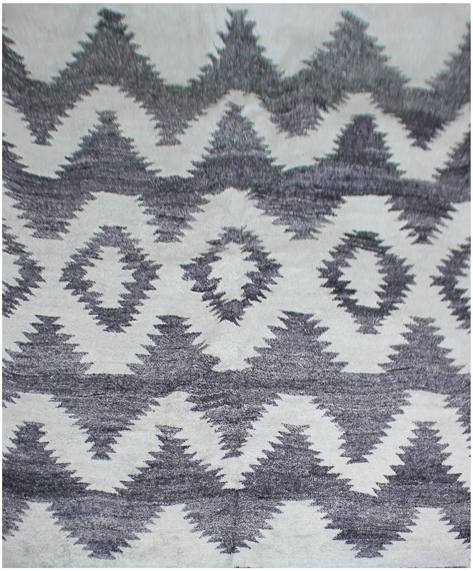 Handmade Bamboo Silk Rug. 10/14 Feet: A beautiful handmade environmentally friendly Bamboo and silk rug, with a geometric design is made of 75% bamboo silk and 25% cotton. The outstanding design, and very popular colors make this piece an