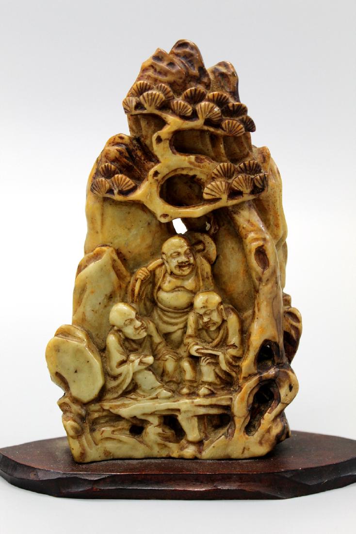 Chinese soapstone carving with wood stand. (1 of 3)