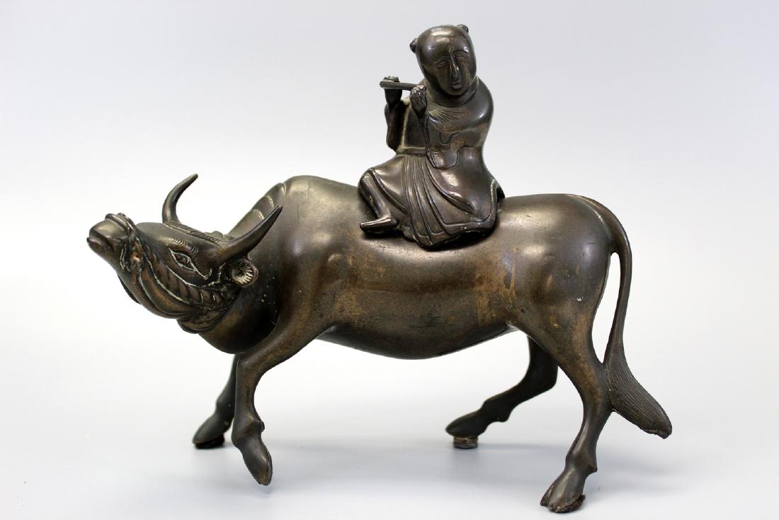 Chinese bronze incense burner,: Chinese bronze incense burner, A boy riding on a water buffalo. 19th C. Ht 17 cm.