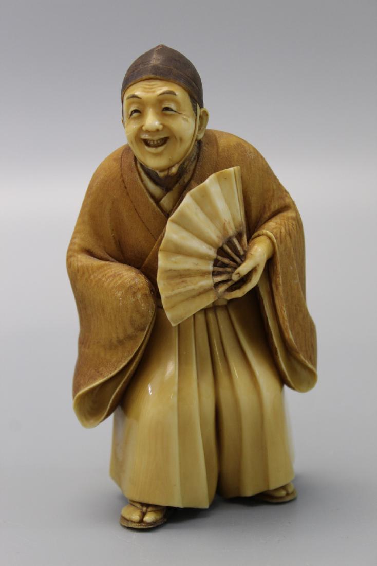Japanese carved figurine. (1 of 3)