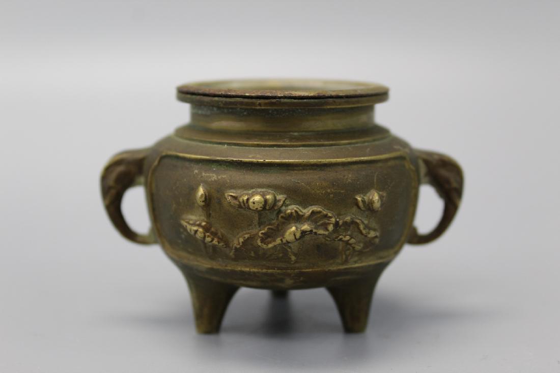 Chinese bronze miniature incense burner.: Chinese bronze miniature incense burner. Ht 6 cm.