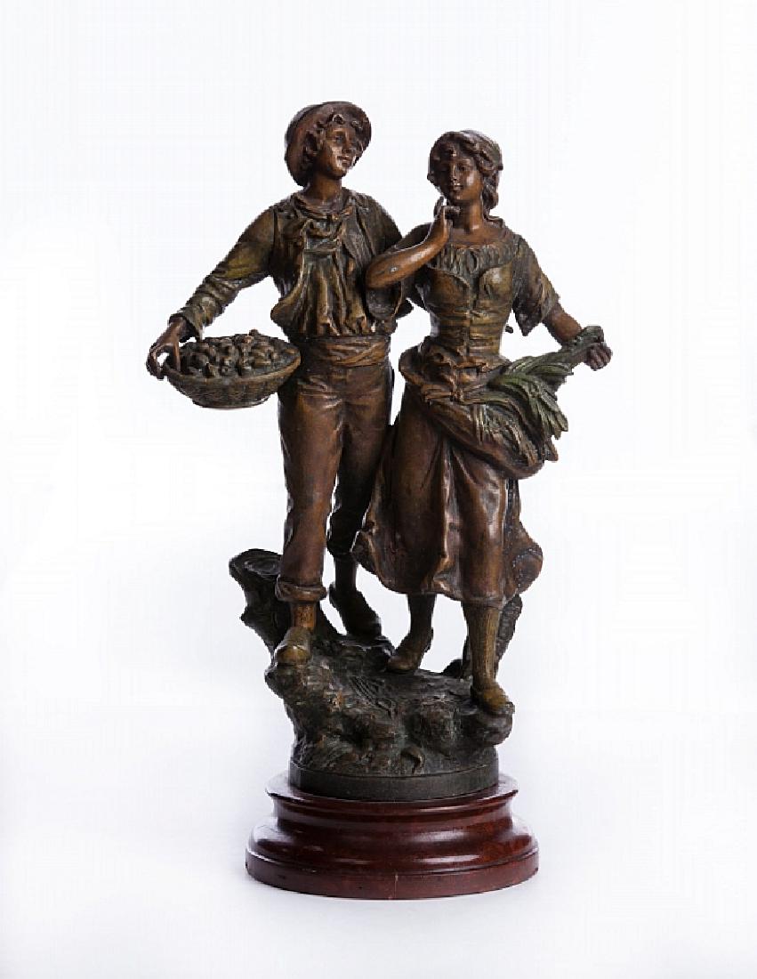 SPELTER GROUP OF MAN & WOMAN SIGNED GEO MAXIM: Geo Maxim spelter group of man and woman signed on base. Man is carrying a basket of fruit and woman is carrying hay. They are on an attached wood base. Has foundry mark on base. Measure approx. 15 3/