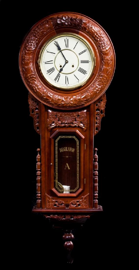 LARGE MAHOGANY REGULATOR ROUND WALL CLOCK: Large mahogany round regulator wall clock, made in Korea. Measures approx 47" long