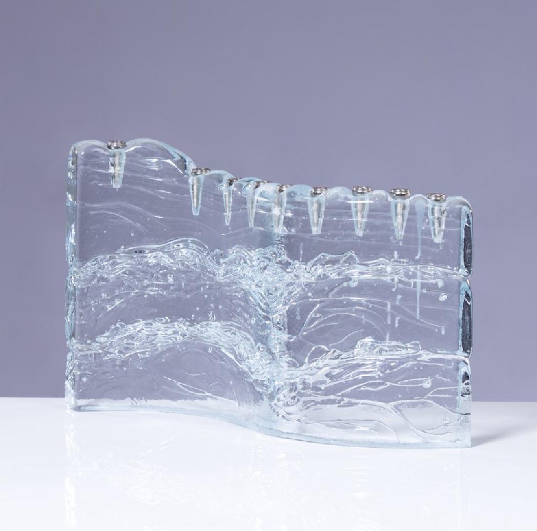 GLASS MENORAH SCULPTURE: Art glass menorah sculpture. Measures approximately 11" L x 6 3/4" h.