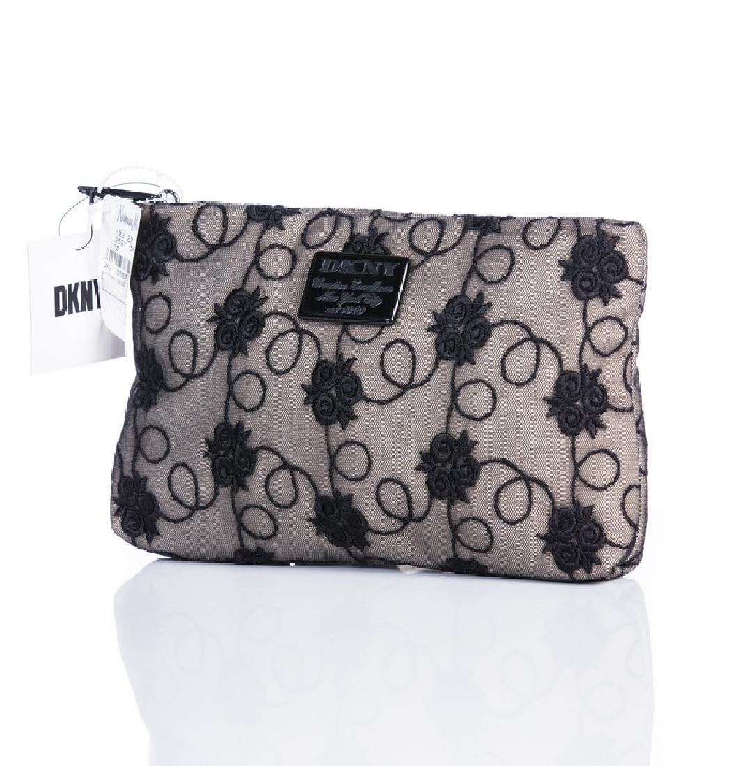 DKNY BLACK LACE CLUTCH: DKNY black lace clutch 9" l x 5 3/4" h . New from Neiman Marcus with tags. Top hand interior zippers.