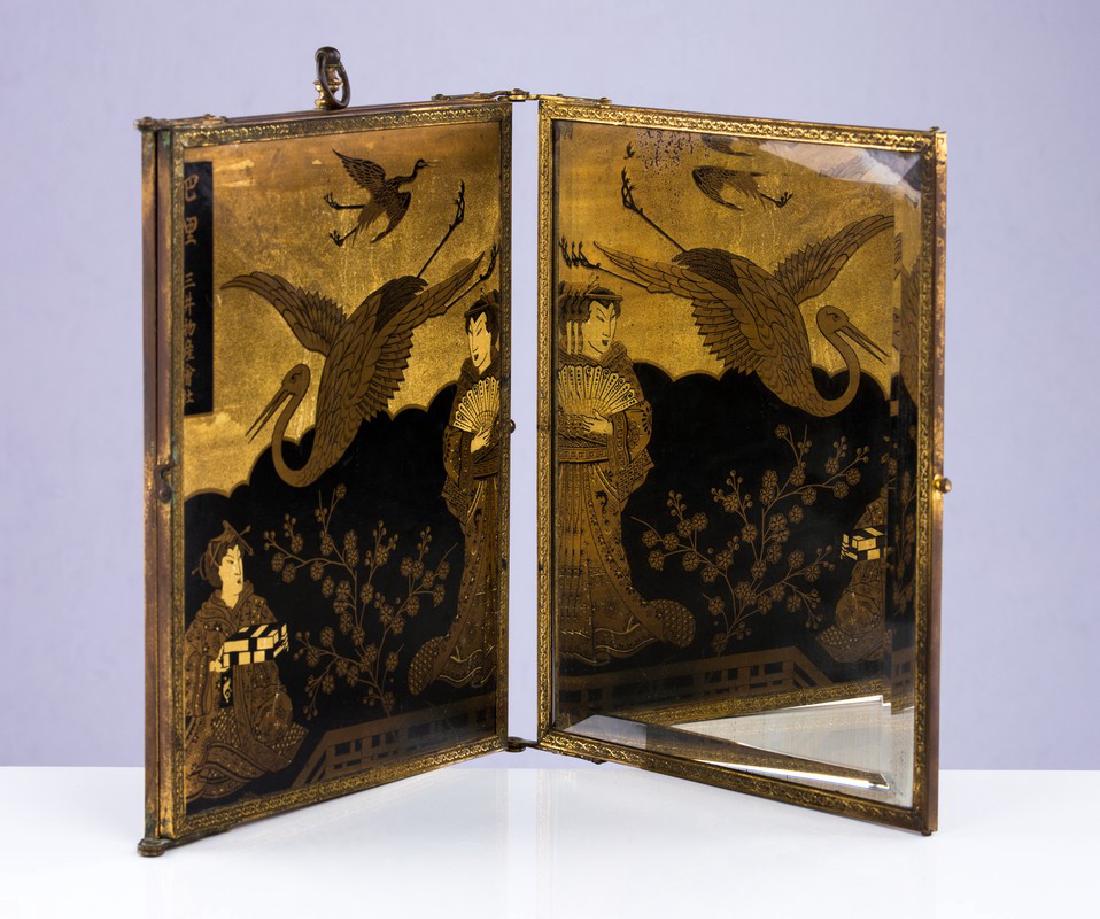 ANTIQUE JAPANESE TRIPTYCH BEVELED GLASS MIRROR: Antique Japanese triptych beveled glass mirror outer part depicts people with cranes. Some loss to mirror. Measures approx 9 1/4" x 11 1/4". (closed)