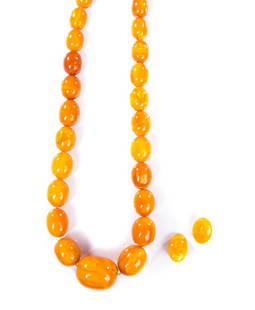 AMBER LARGE GRADUATED BEAD NECKLACE: Amber large graduated necklace in orangey shades. Largest 35 mm (L) x 30 mm (w) Smallest 15 mm (L) x 10 mm (w). Weighs 141 grams.