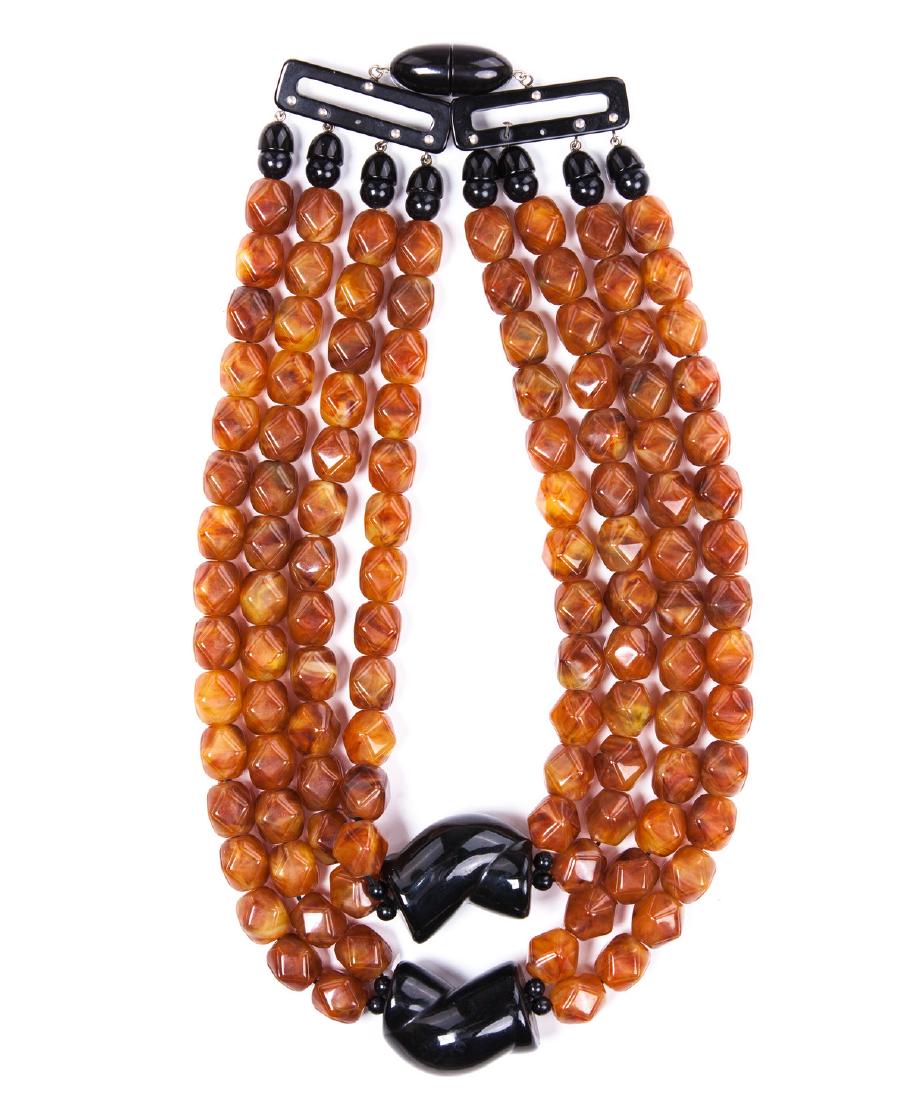 BAKELITE LIKE CHUNKY NECKLACE: Bakelite like chunky black and amber color 4 strand necklace.