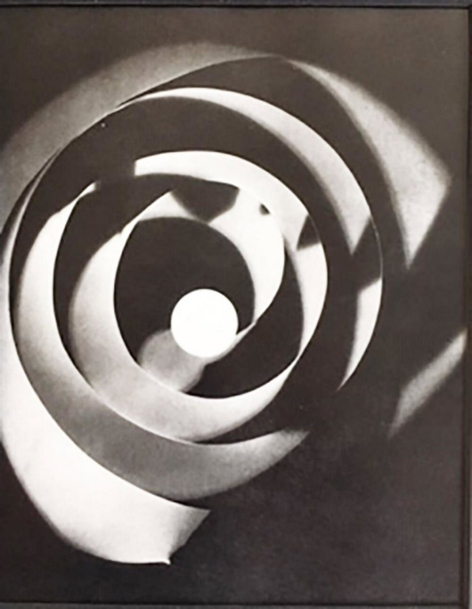 Man Ray - rayograph spiral 1925: Man Ray - rayograph spiral 1925 photolito. 11x12.5 matted inch.