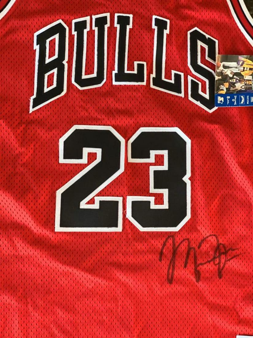 Michael Jordan Signed Chicago Bulls Basketball Jersey: This is a hand signed / autographed Chicago Bulls red basketball jersey. This has been signed by Legendary Superstar and Hall of Fame member Michael Jordan. The piece comes with a gallery coa
