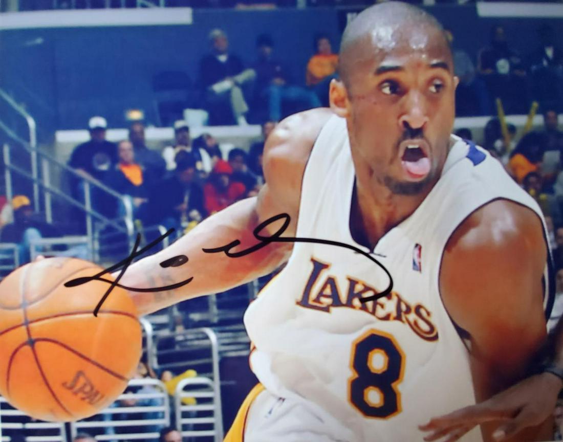 Kobe Bryant, 8x10 autographed photo: This is a signed / autographed 8x10 color photo. It has been signed by legendary Los Angeles Lakers superstar and future Hall of Farmer Kobe Bryant.