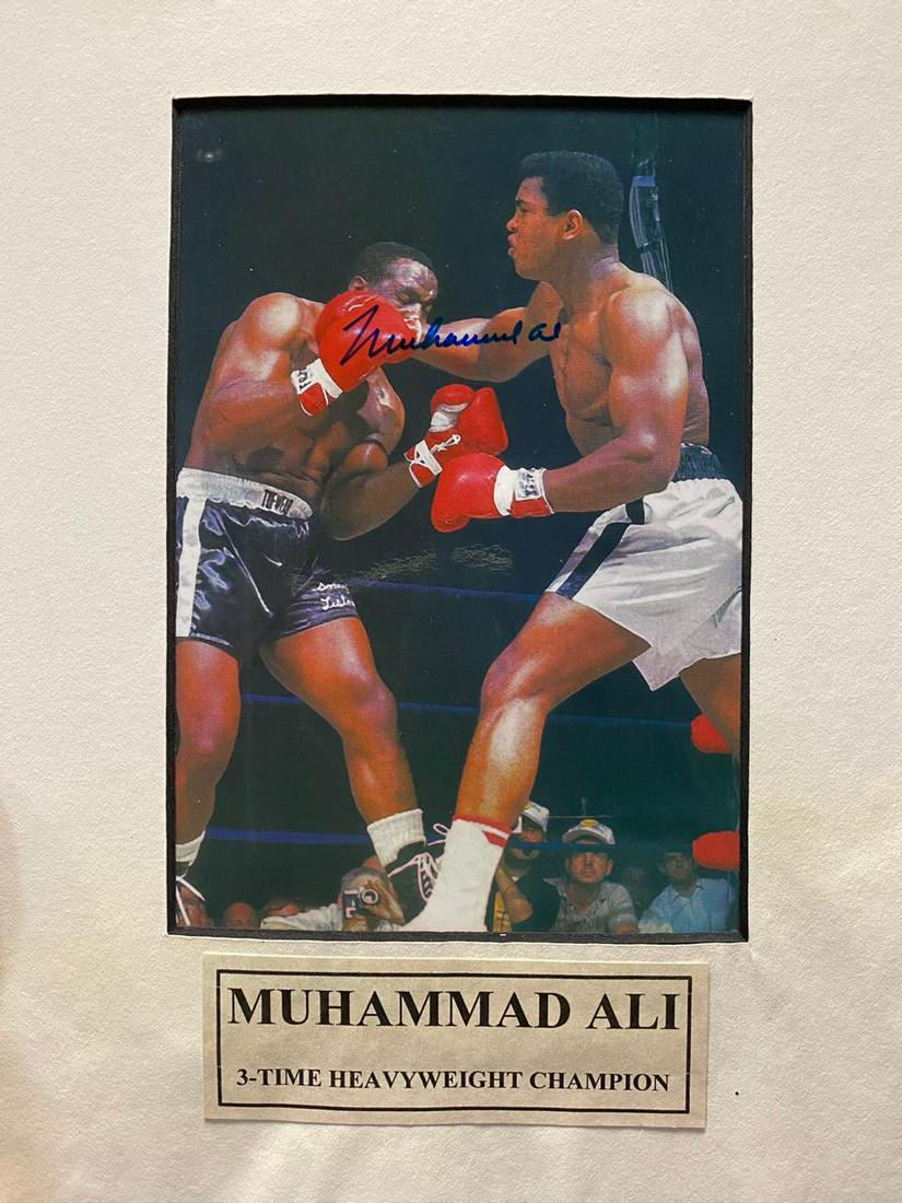 Autographed Muhammad Ali Boxing Heavyweight Champ Mat: Autographed Muhammad Ali Boxing 3 time heavyweight champion, Matted Medium: Autographed Photograph Note: Dimensions provided include matting