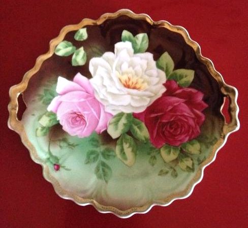 Royal Vienna German Bavaria Rose Handled Plate: Antique, late 1800's-early 1900's Royal Vienna German Bavaria plate with roses and gold trim. Gold trim shows some wear but otherwise in good condition. "Royal Vienna Hand-Painted" is stamped on the b