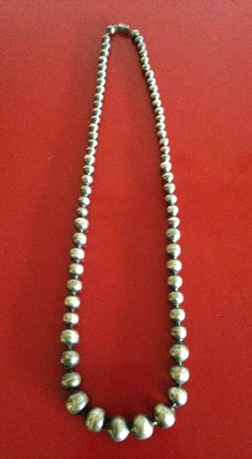 Antique Sterling Silver Taxco Graduated Mexican Beads: Unique antique sterling silver graduated Taxco Mexican beads each linked together with wire. The clasp is stamped "Mexico T19-15 925." In excellent condition. Total weight is 109.10 grams and length i