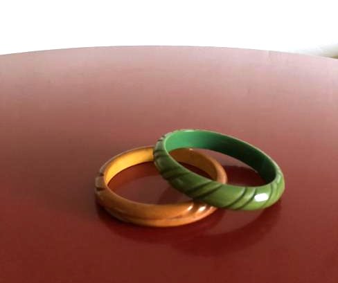 Two Carved 1950's Bakelite Bracelets: Two vintage carved bakelite bracelets from the 1950's. Both are in very good condition with minimal wear and scratches on them. They each measure approx. 2.5" in diameter inside. From a local, private