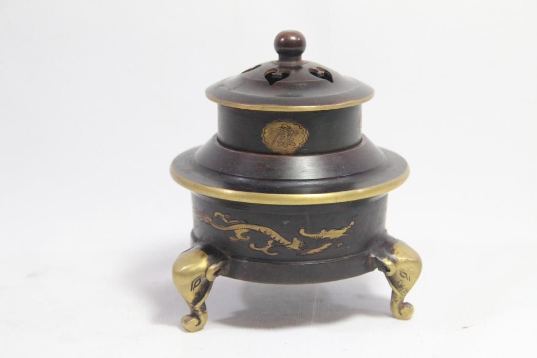 Chinese three foot bronze censer: Chinese three-foot bronze censer with calligraphy; dragon; and elephant motif, has mark on bottom 6"H