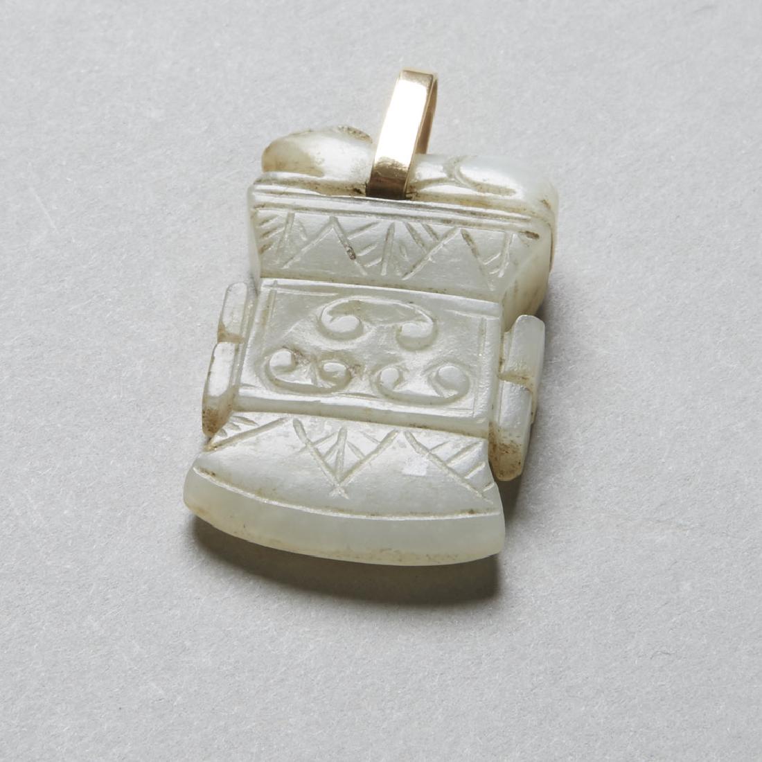 Chinese 19th Jade Pendant Archaic Axe Head - BTC Acpt: A striking jade pendant. Excellent to function as everyday jewelry. Bale well made of unmarked gold. Dimensions: 1 1/2 in. x 7/8 in. Notes: For more information regarding Revere Auctions acceptance of
