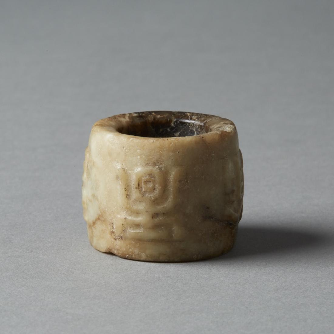 Archaic Chinese Brown Hardstone Archers Ring - BTC Acpt: A hand carved archers ring of a hard stone, likely not jade. Dimensions: 1 in. x 1 2/8th in., Weight: 30.3g Notes: For more information regarding Revere Auctions acceptance of Bitcoin, please review t