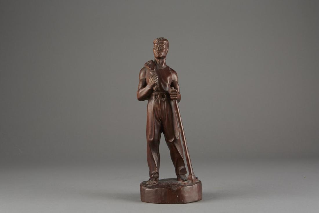 Chinese Republic Period Carved Wooden Figure - BTC Acpt: Fantastic wood carving of a farmer with his hoe in hand and jacket slung over his shoulder. His bare feet reveal the desired simple lifestyle of the time period. Dimensions: 10 1/2in. x 3 7/8th in. Ba