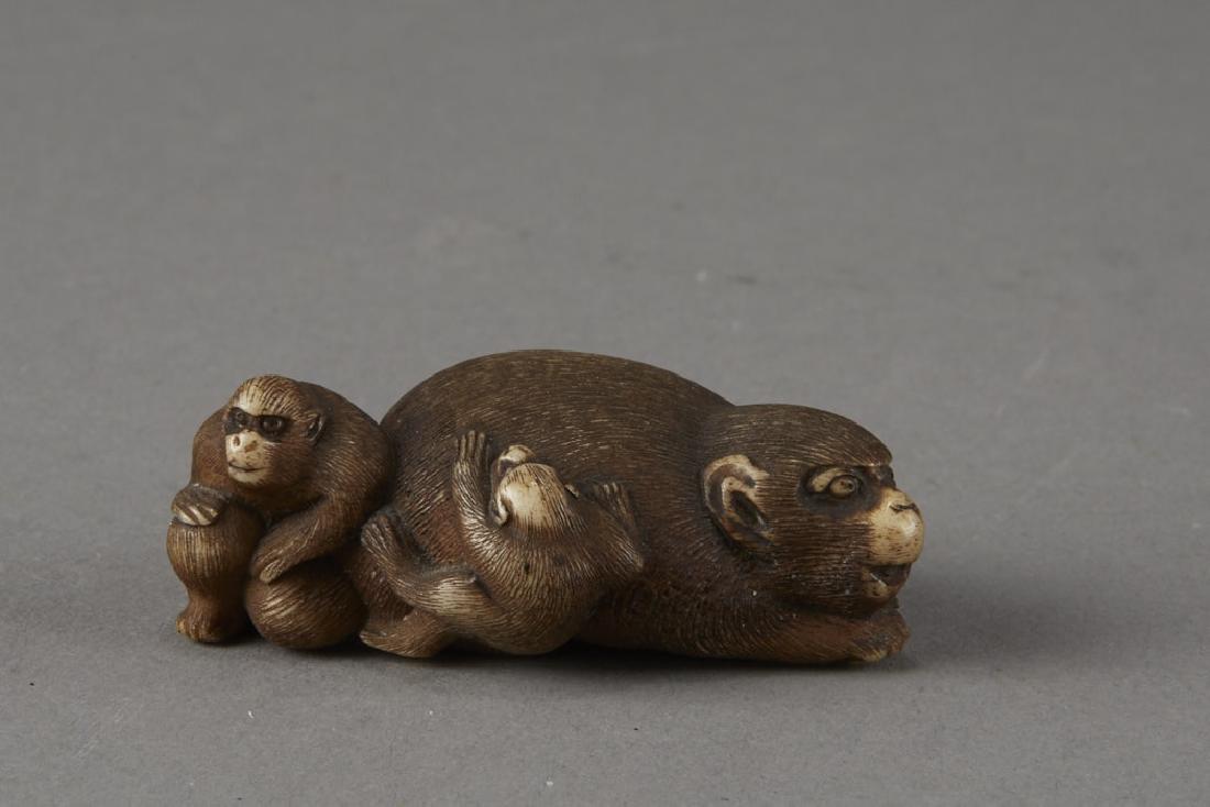 Japanese Stag Antler Netsuke Monkeys: An incredible stag antler netsuke carving of a monkey and children. Excellent carving rendering each detail in fantastic quality. A small reserve on the bottom may once have held a signature but it is