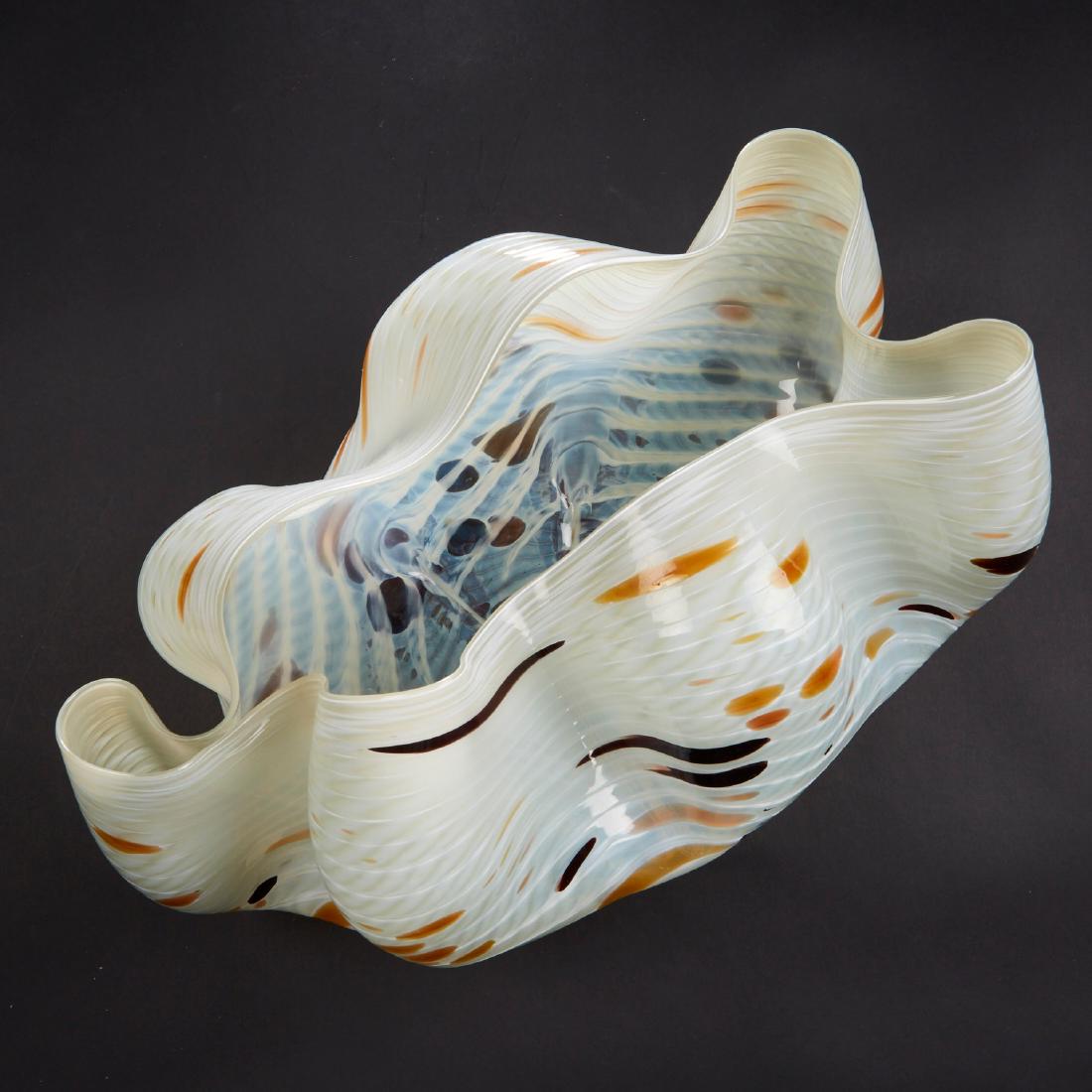 Dale Chihuly Seaform Vessel Art Glass: Dale Chihuly (b. 1941). White seaform vessel with tan and red spots and curling edges. Provenance: Directly from artist; collection of Edward Claycomb. Biography: Dale Chihuly first encountered glass 
