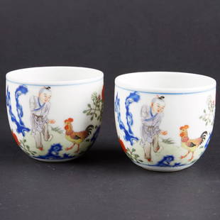 Pair of Chinese Famille Rose Cups with Boy and Chickens: Pair of Chinese famille rose porcelain cups from the Republic Period decorated with the â€œPrecocious Chicken Boyâ€ with chickens and a poem by the Qianlong emperor. Cups bear apocryphal Qianlo