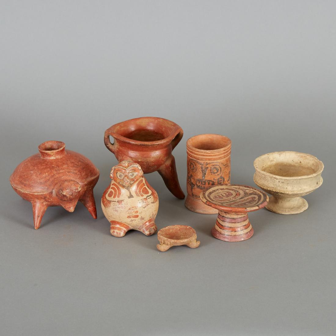 7 Small Pre-Columbian Ceramics: Seven small Pre-Columbian ceramic items, including: one Toltec beaker (600-1200 C.E.); one Nicoya effigy vessel (800-1200 C.E.); one Jalisco turtle vessel (c. 100 C.E.); one Cocle Fruiteria miniature 