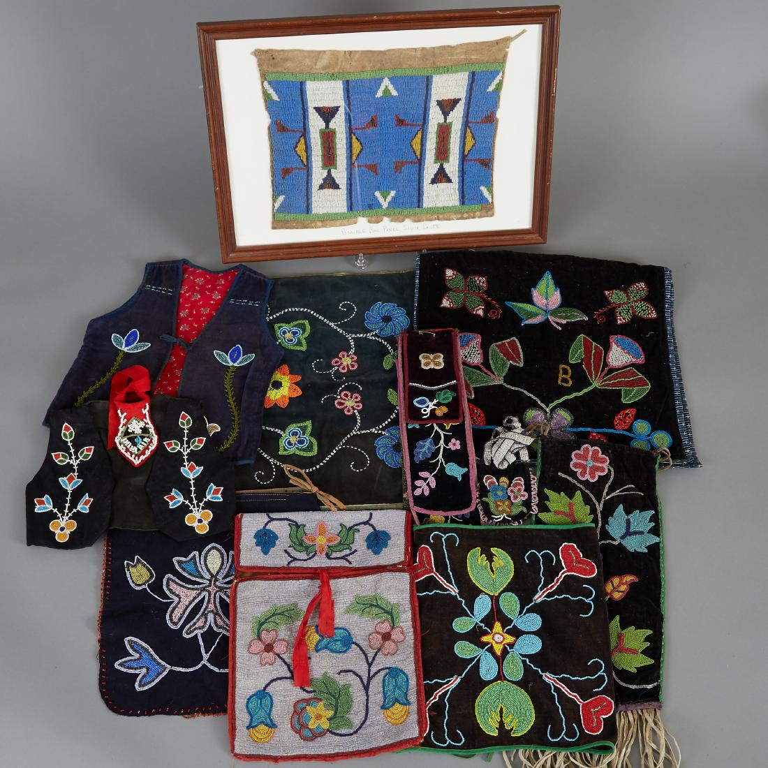 Group of 12 Native American Beaded Items Ojibwe: Group of twelve Native American beaded items. Three Ojibwe beaded dance aprons with floral designs on black velvet, circa early 20th century; two Ojibwe children's beaded ceremonial vests, circa 20th 