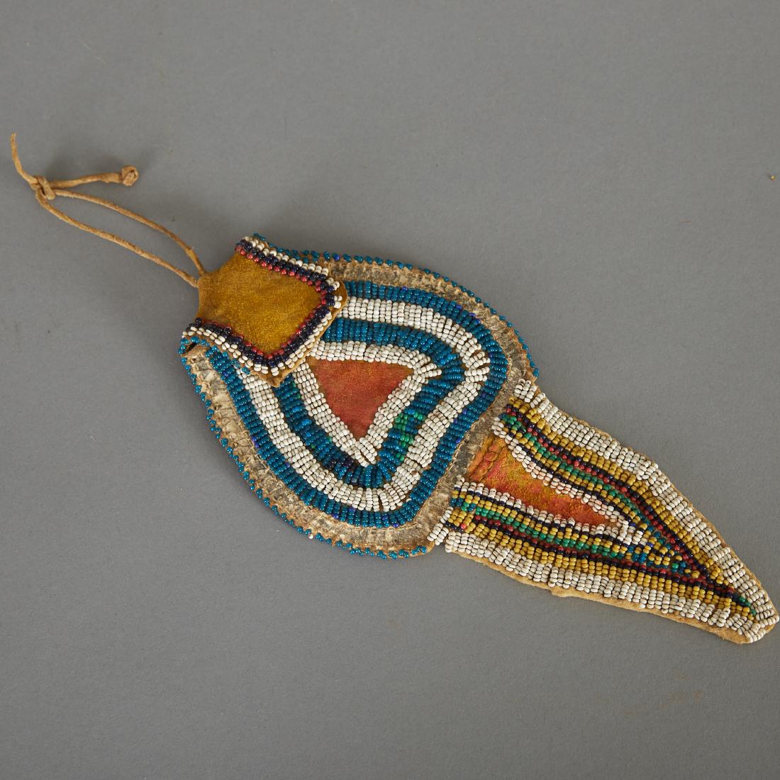 Ute Tail Bag Late 19th c.: Ute beaded tail bag made with tanned hide, circa late 19th century. Dimensions: Height: 8 1/4 in x width: 4 in.