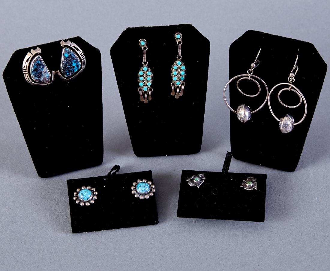 5 Pair Zuni & Navajo Earrings Gilbert Nelson: Five pairs of Native American earrings. One pair Zuni sterling silver and turquoise Snake Eye cluster dangle earrings with nine stones; one pair Gilbert Nelson (Navajo) sterling silver and turquoise e