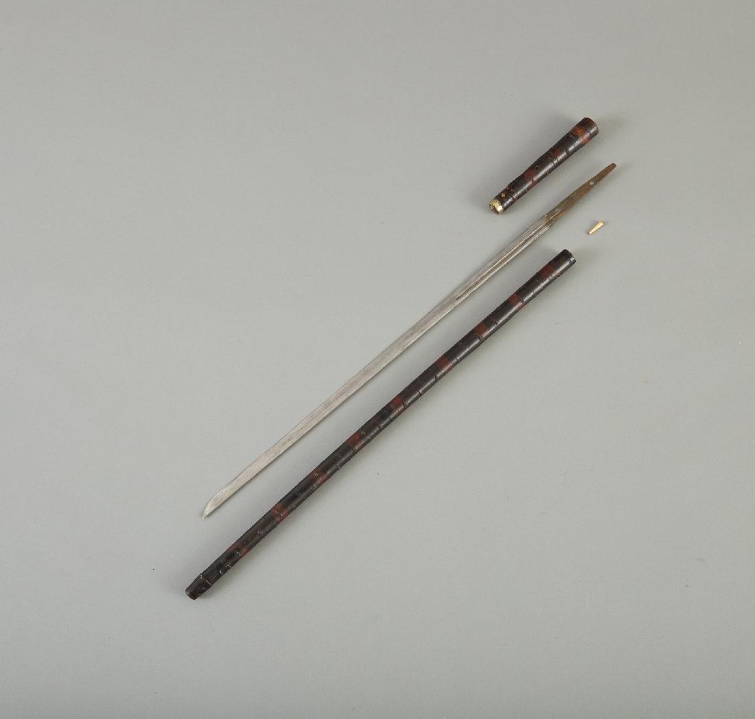 Japanese Meiji Period Sword Cane: A fine Japanese Meiji period sword cane made to look like an old wizened stick. Blade can be removed from handle by removing bamboo pin. Dimensions: Length: 22 3/4 in. SKU: 01109