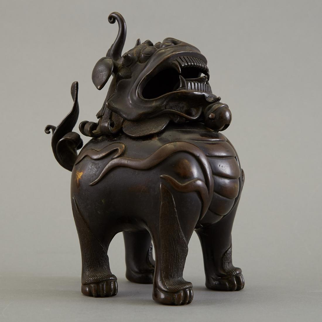 Late Qing Chinese Bronze Buddhist Lion Censer: A handsome late Qing Chinese Buddhist lion or shi shi censer that tilts open and is well cast. Late 19th or early 20th century. Dimensions: Height: 7 in x width: 5 1/4 in x depth: 4 1/4 in. SKU: 01145