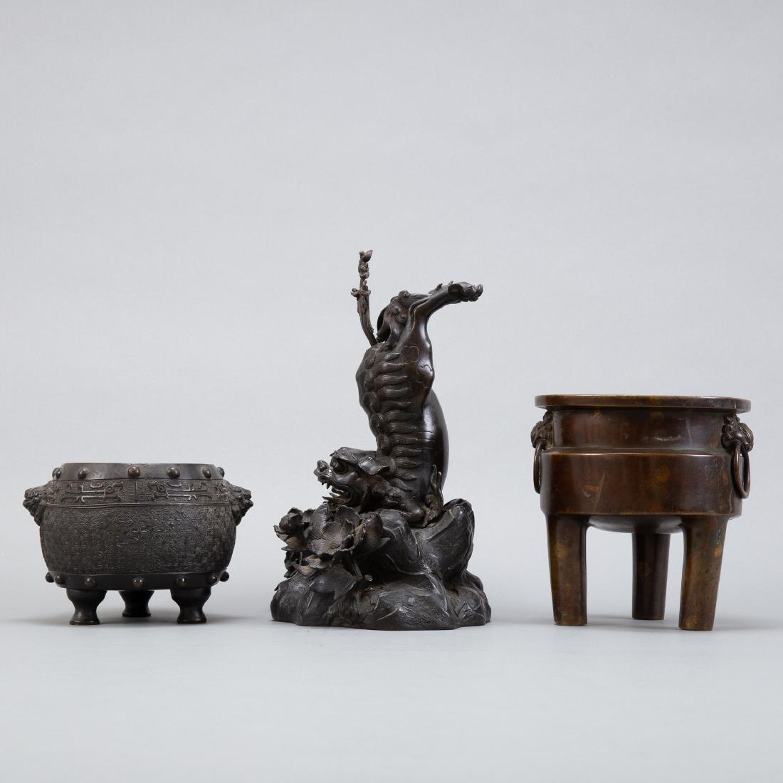 3 Chinese Qing Bronze Censers: Group of 3 late Qing Chinese bronze pieces. One inkwell with a foo dog the other two cast and patinated. All very well made and excellent examples of early bronze craftsmanship. Dimensions: Foo dog in