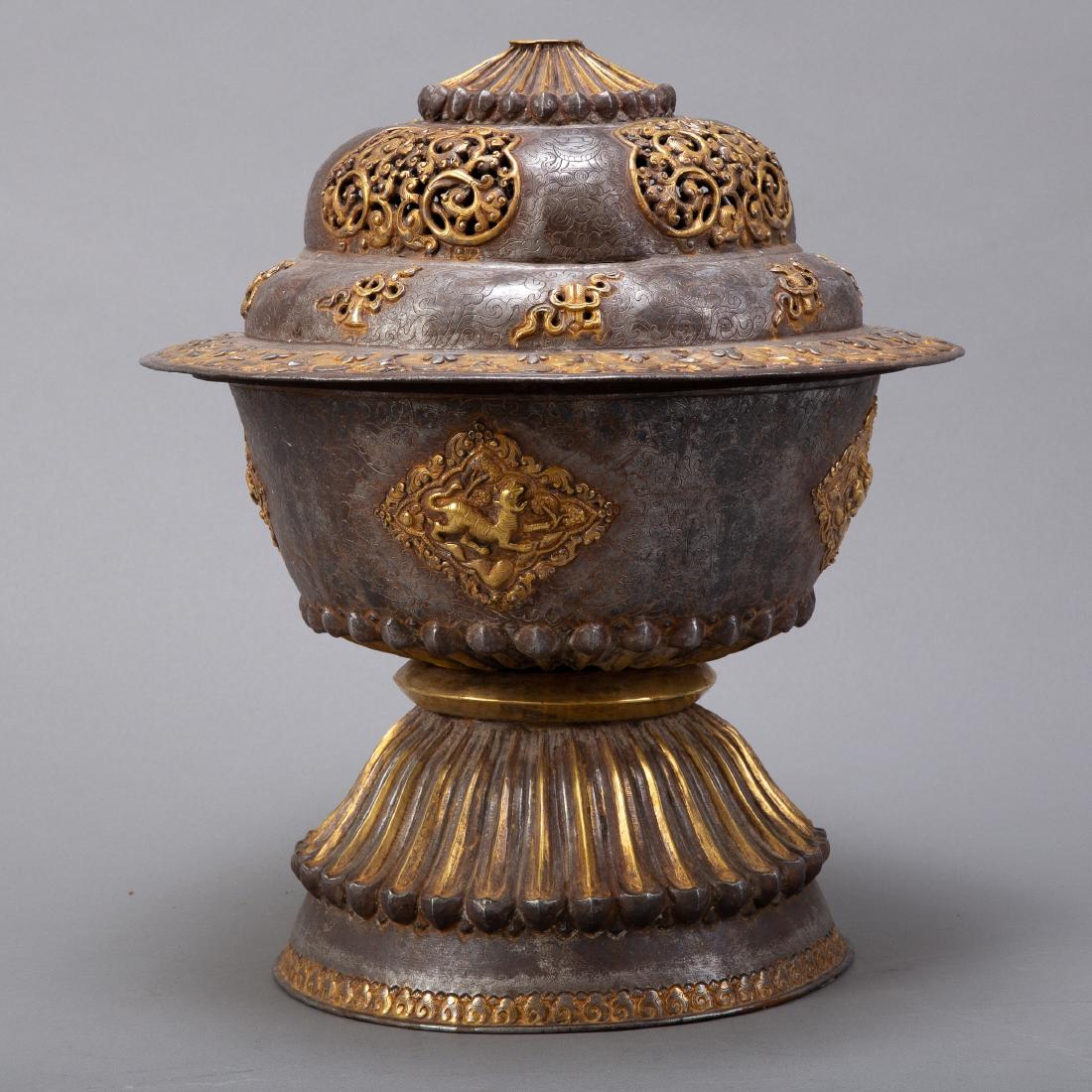 Large Tibetan/Chinese Altar Vessel Censer: A very large Chinese Tibetan altar vessel or censer with silver and gold gilt. Lovely worked repousse decoration. Well formed with a hole in the top for the smoke to escape. Dimensions: Height: 15 in 