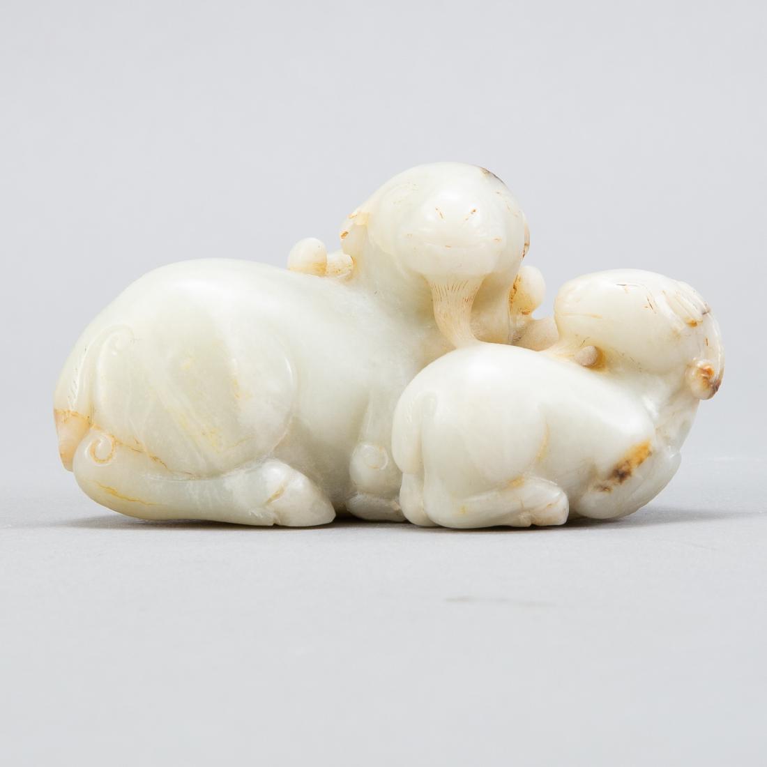 Chinese Qing Pale Celadon Jade Carving of 3 Rams: Chinese pale celadon jade carving with lovely russet inclusions of a group of three rams. Very well carved and of substantial size. This is an excellent example of Qing animal carving. Provenance: Ash