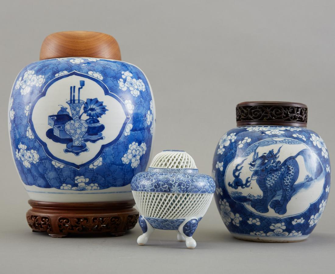 Group of 3 Pieces Chinese Blue and White Porcelai: Group of three pieces of Chinese blue and white porcelain, composed of two ginger jars with carved wood lids and one small reticulated tripod covered vase. The smallest censer is Japanese Hirado porce