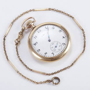 Elgin Gold Filled Pocket Watch w/ Chain: Elgin Watch Company, USA. Gold-filled open face pocket watch with chain. White porcelain dial is marked "Elgin" and has one subsidiary dial. Watch runs. Dimensions: Face diameter: 2 in. Length of chai