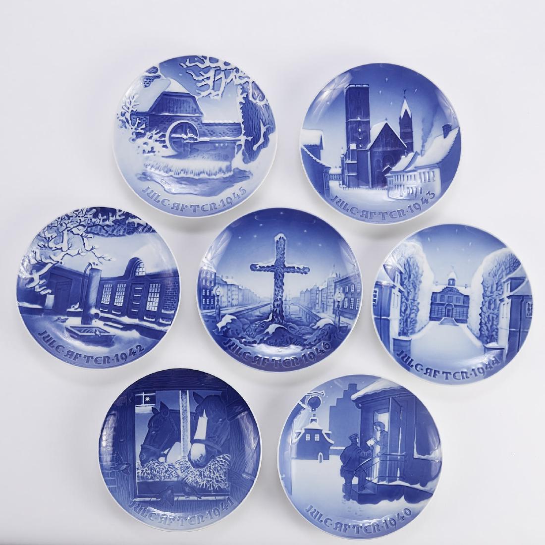 Bing and Grondahl Christmas Plates 1940s: Bing and Grondahl, Denmark. Group of ten blue and white porcelain Christmas Eve (Jule Aften) plates, dating from 1940-1949. Dimensions: Height: 1 in x diameter: 7 1/8 in. SKU: 01360