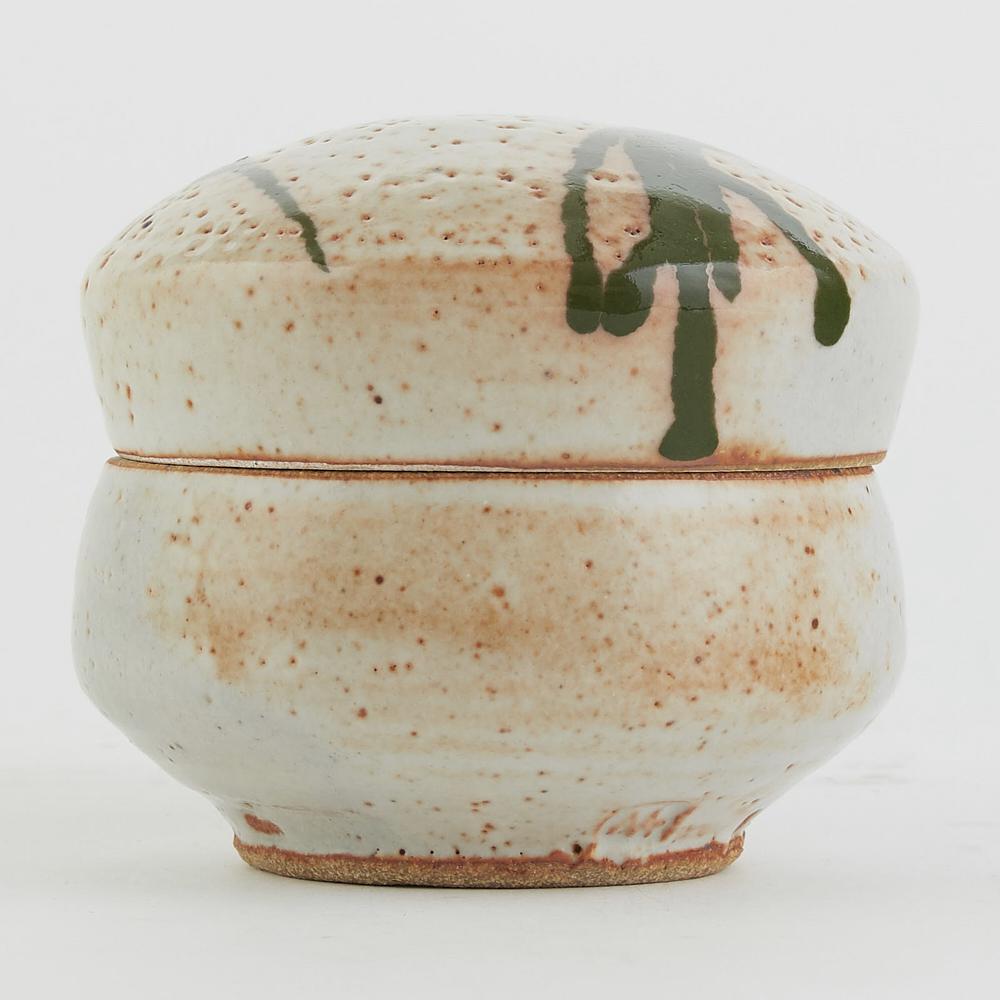 Warren MacKenzie Studio Pottery Lidded Rice Bowl: Warren MacKenzie (1924-2018). Lidded studio pottery ceramic rice bowl with orange and green drip glaze. Marked along the footrim. Warren MacKenzie was a renowned Minnesota studio potter. A student of