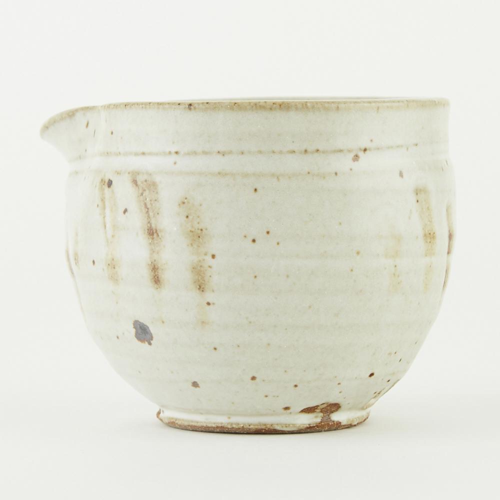Warren MacKenzie Studio Pottery Creamer/Sauce Bow: Warren MacKenzie (1924-2018). Studio pottery ceramic creamer/sauce bowl. Glazed stoneware. Marked along the footrim. Warren MacKenzie was a renowned Minnesota studio potter. A student of Bernard Leach