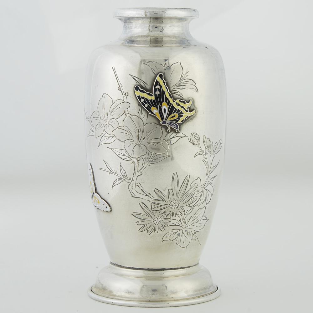 Korean Silver Vase with Enamel: Korean silver vase with an incised floral design and raised enamel butterflies. Inscribed on the reverse: "To: Mrs. William Simmler Jr, 'Merry Christmas From: Commandant & Mrs. Lee Yong." Hallmarked u