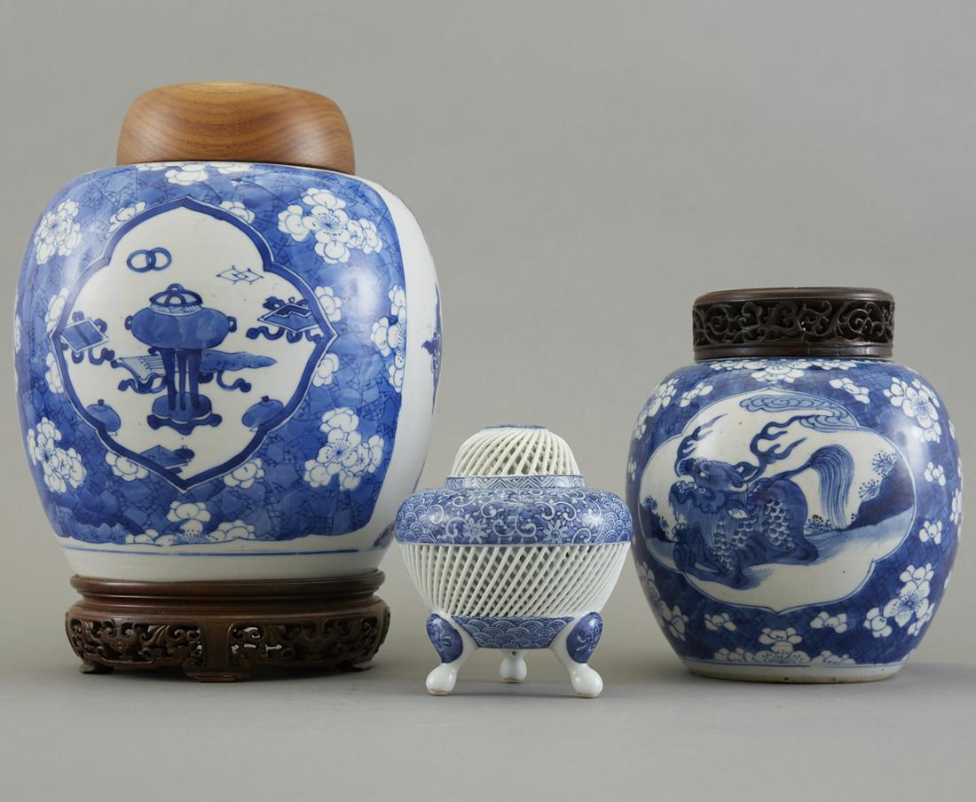Group of 3 Pieces Chinese Blue and White Porcelai: Group of three pieces of Chinese blue and white porcelain, composed of two ginger jars with carved wood lids and one small reticulated tripod covered vase. The smallest censer is Japanese Hirado porce