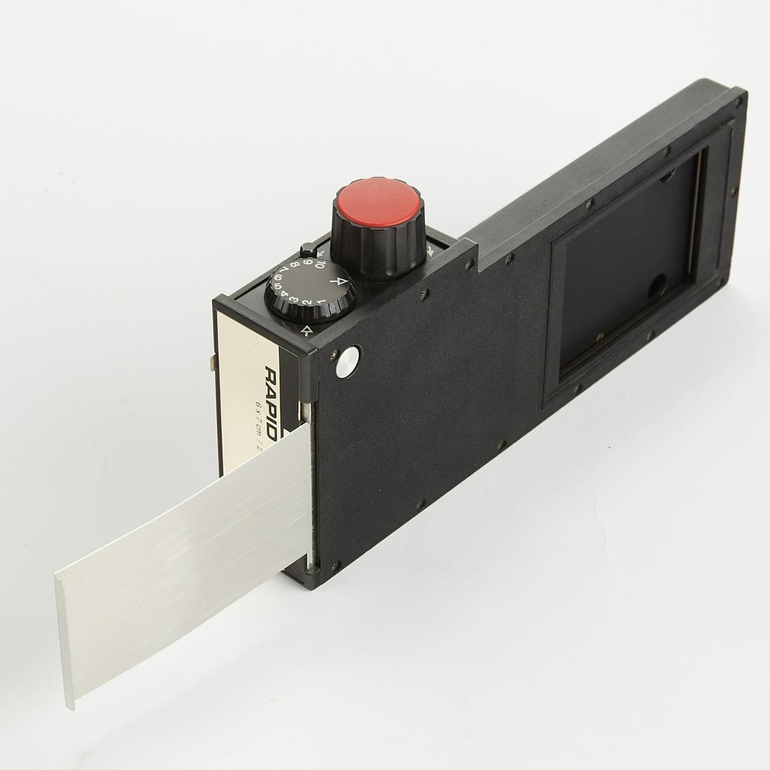 Linhof Rapid Rolex 6x7 cm Film Back: Linhof Rapid Rolex 6x7 cm film back. Dimensions: Height: 4.25 in Depth: 1 1/2 in Width: 8 1/4 in SKU: 03015