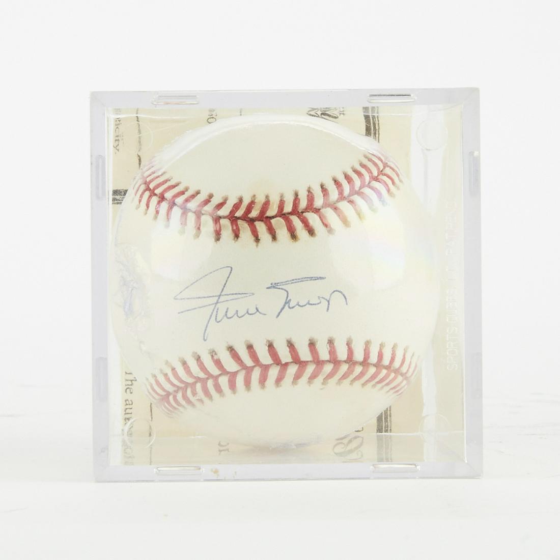 Signed Baseball Willie Mays: One baseball signed by Willie Mays. Ball is in a shadow box with a certificate of authenticity confirming that the autograph is authentic. Dimensions: Height: 3 1/4 in x width: 3 1/4 in x depth: 3 1/4