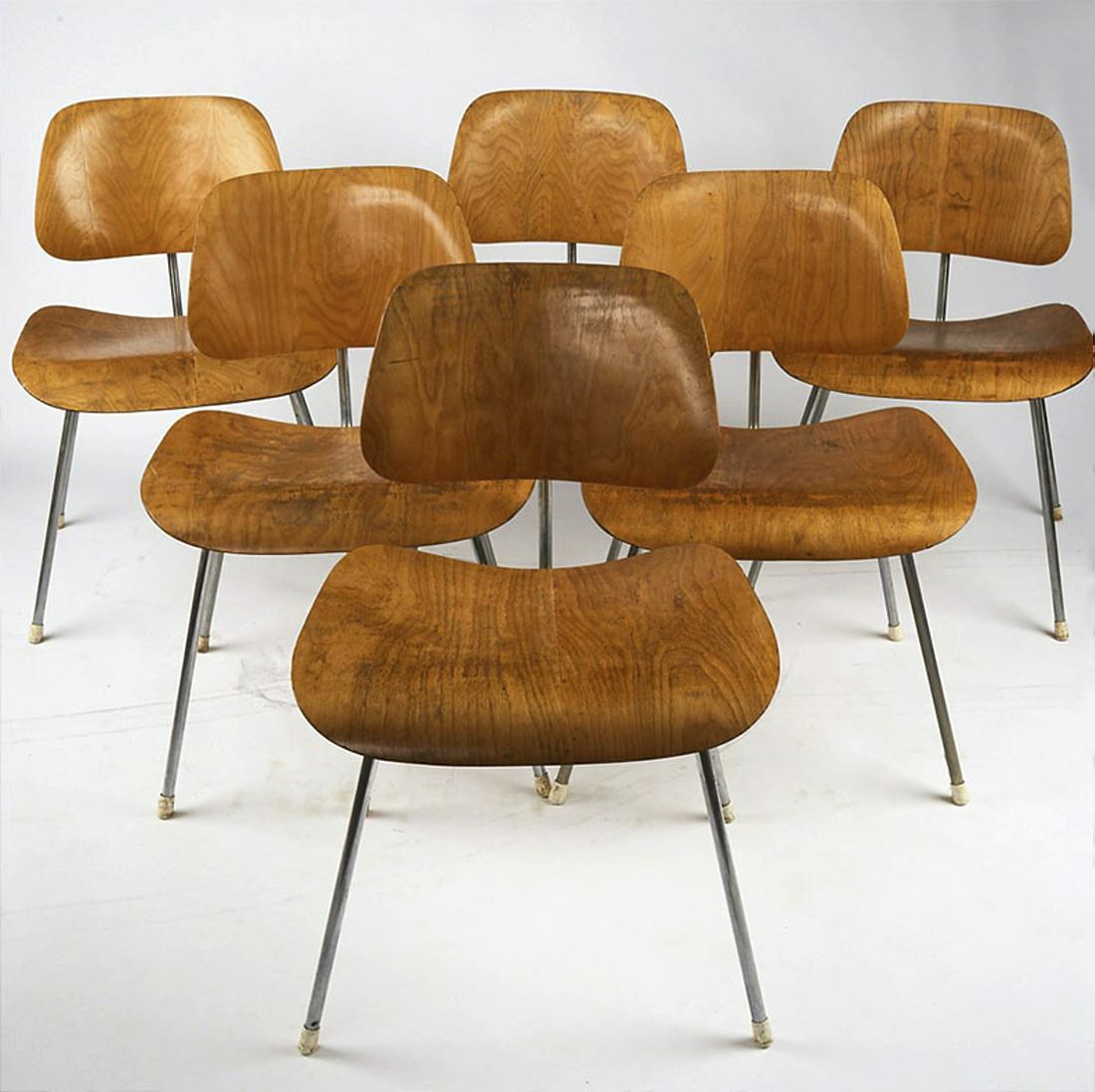 Set of 6 Eames for Herman Miller DCM Chairs: Charles Eames (1907-1978) and Ray Eames (1912-1988) for Herman Miller, USA. Set of six DCM chairs. Molded birch plywood, chromed metal, rubber. All chairs retain Herman Miller labels under the seat. W