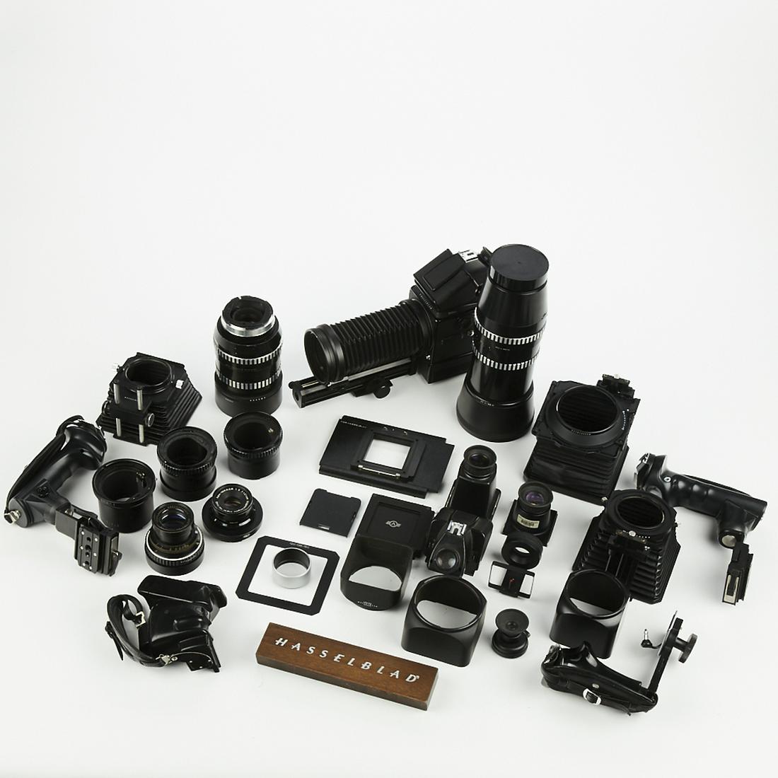 Hasselblad Camera Body w/ Accessories and Lenses: Hasselblad camera body with a large group of accessories and lenses. SKU: 03398