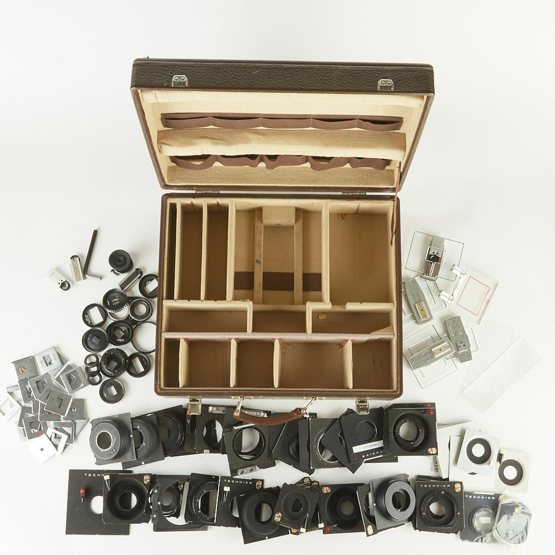 Large Group of Linhof Technika Lens Boards and Ot: Large group of Linhof Technika lens boards and other camera accessories. Includes a large group of lens boards, frame finders and frame masks. In a case for the Linhof Super Technika 6x9 3 or 4. SKU:
